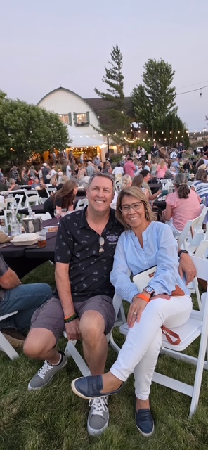 Raven and her fiancé at a community event