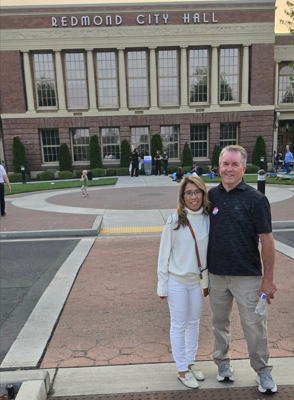 Raven with sitting Redmond City Councilor Jay Patrick near Redmond City Hall